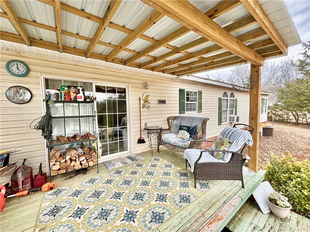 354 Harper Road Pendleton, SC 29670 - Photo 25 of 30 This inviting patio area features a covered deck, perfect for relaxation and outdoor enjoyment.