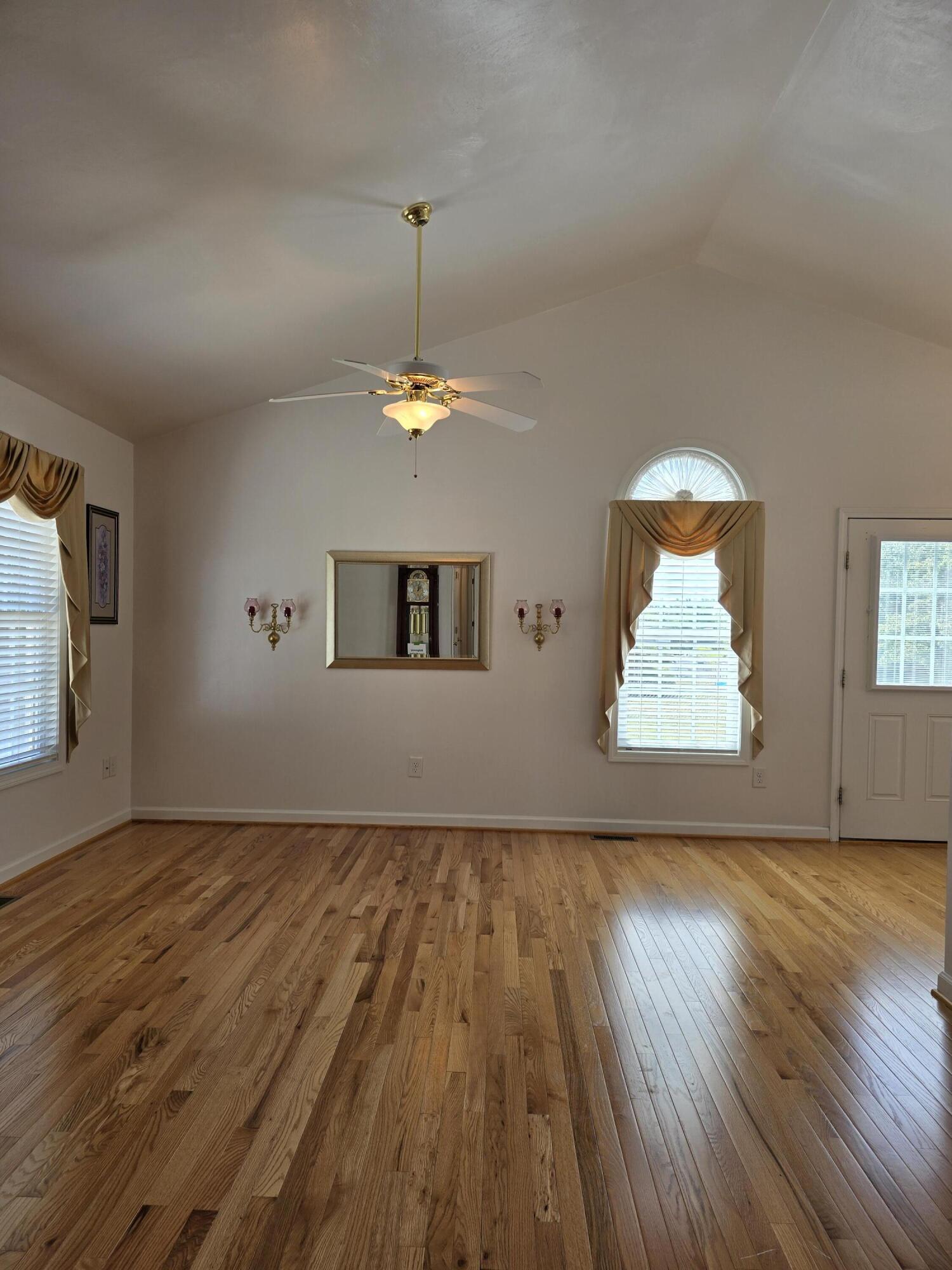 2341 Highland Road Roanoke, VA 24014 - Photo 5 of 30 an empty room with wooden floor table and chair