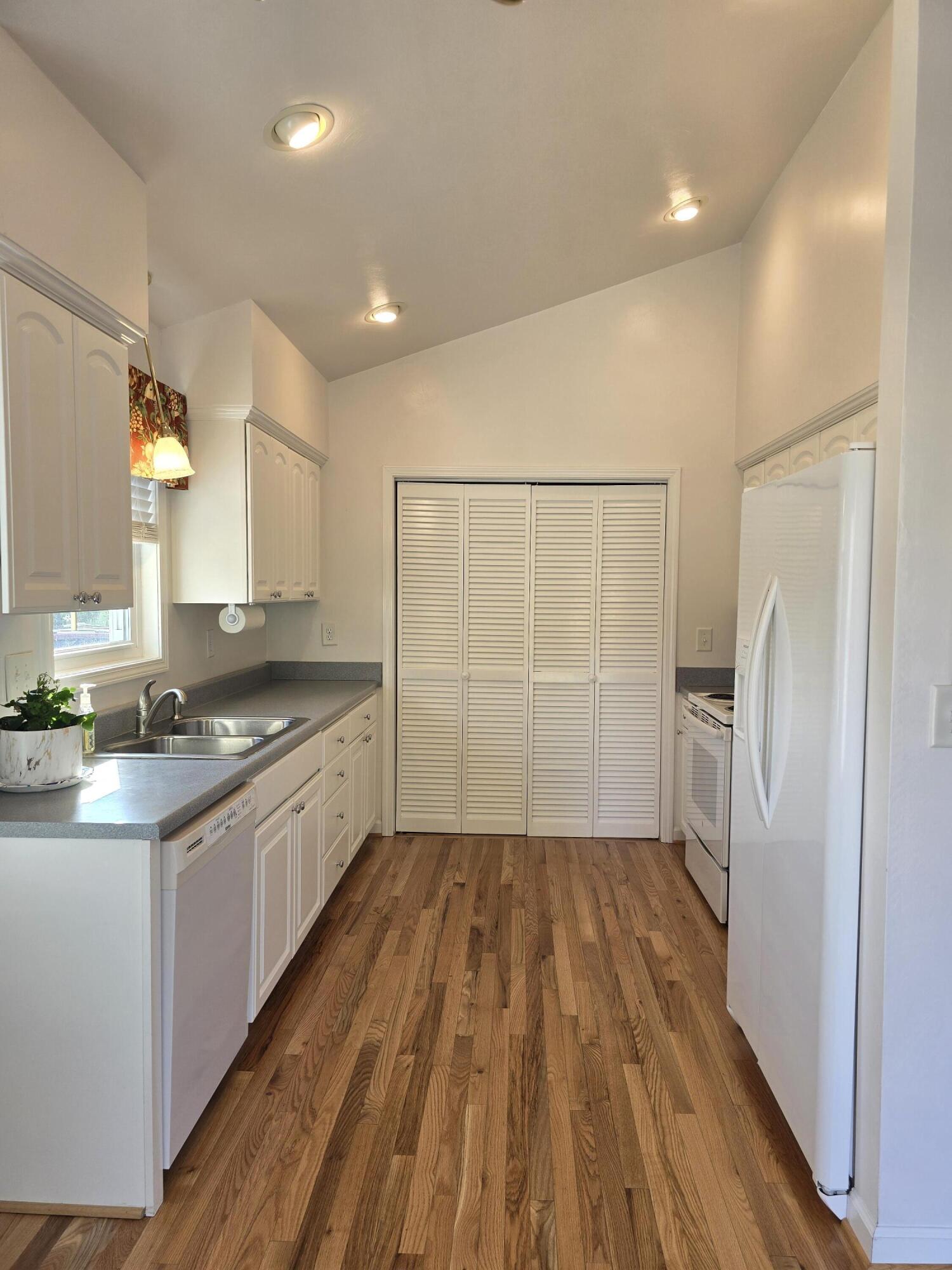 2341 Highland Road Roanoke, VA 24014 - Photo 8 of 30 a large kitchen with a sink and refrigerator