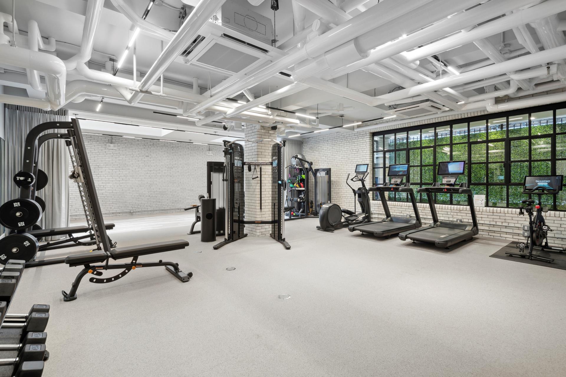 155 East 72nd Street, Unit 7C/8CD Manhattan, NY 10021 - Photo 12 of 17 a view of a room with gym equipment