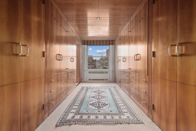 a bedroom with a bed window and couch
