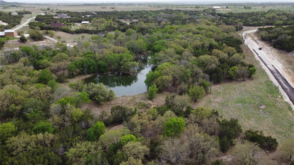 1039-1033 Creek Crossing Road Nemo, TX 76070 - Photo 21 of 31 an aerial view of residential houses with outdoor space and trees