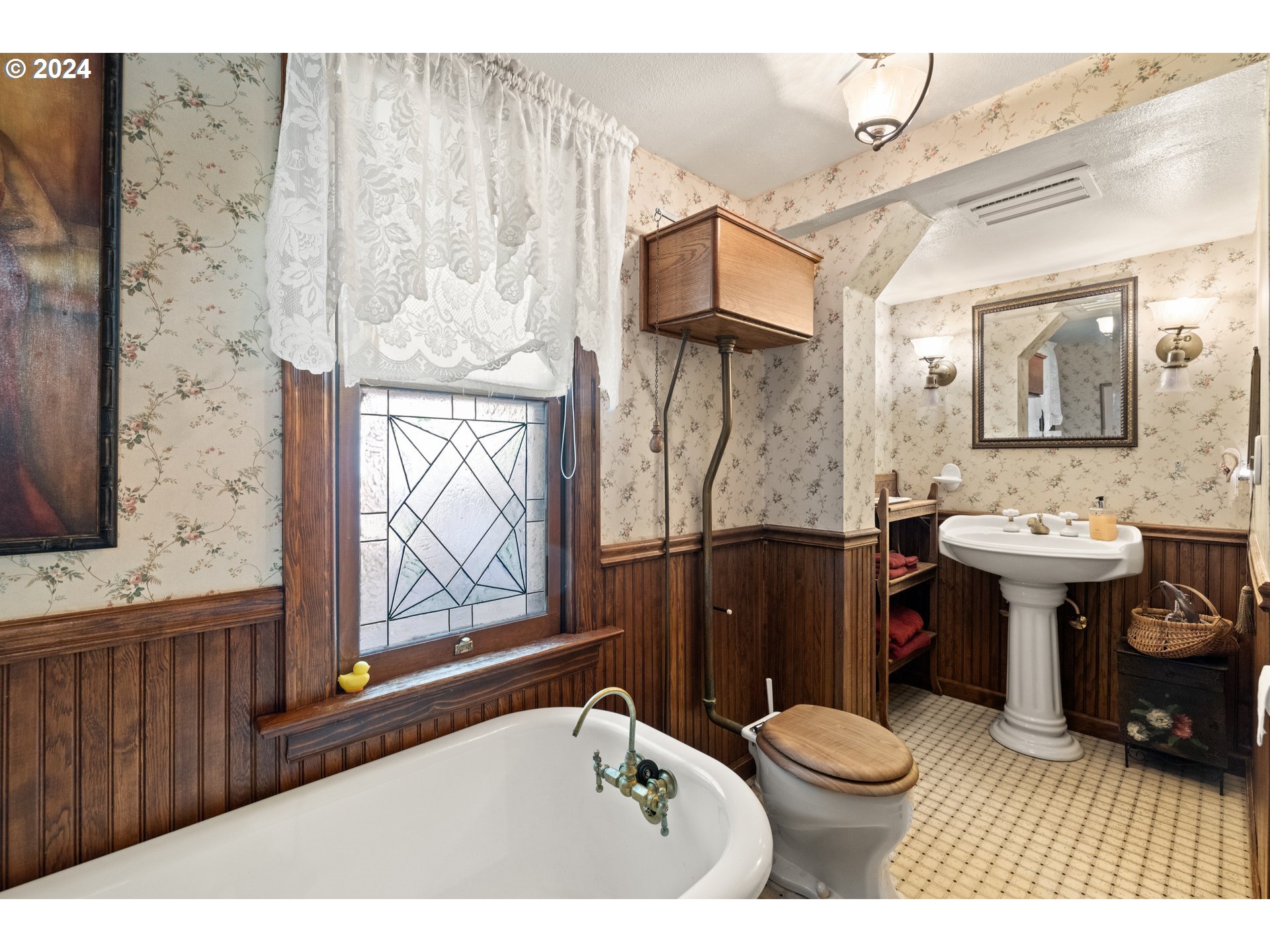 1927 Northeast 16th Avenue Portland, OR 97212 - Photo 17 of 43 a bathroom with a sink toilet and shower