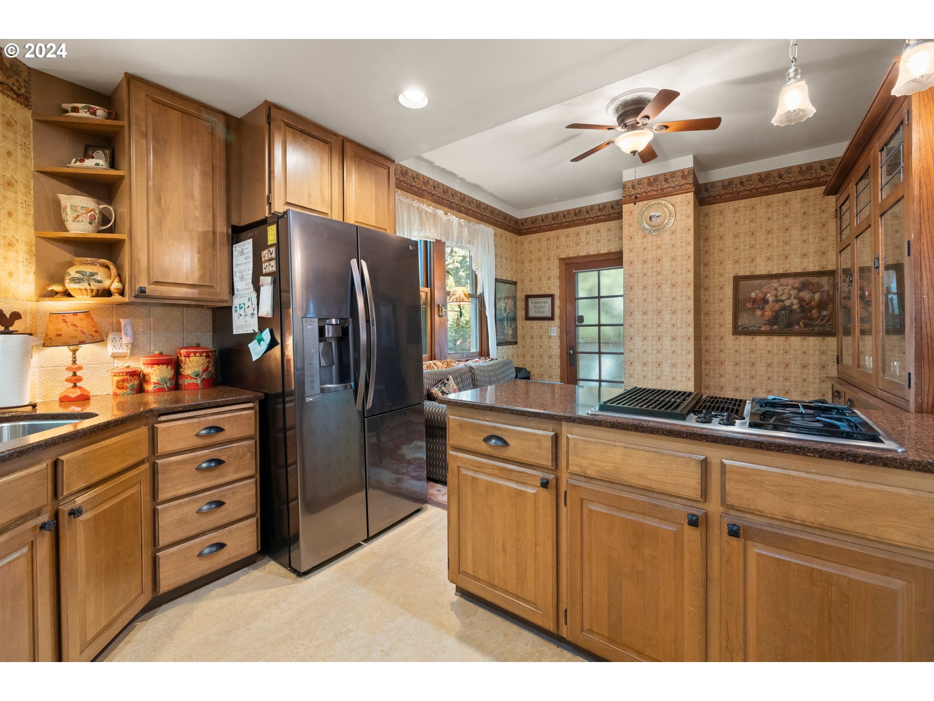 1927 Northeast 16th Avenue Portland, OR 97212 - Photo 21 of 43 a kitchen with stainless steel appliances granite countertop a refrigerator and cabinets