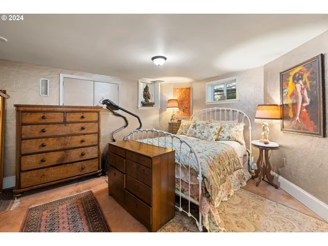 a bedroom with a bed and a dresser