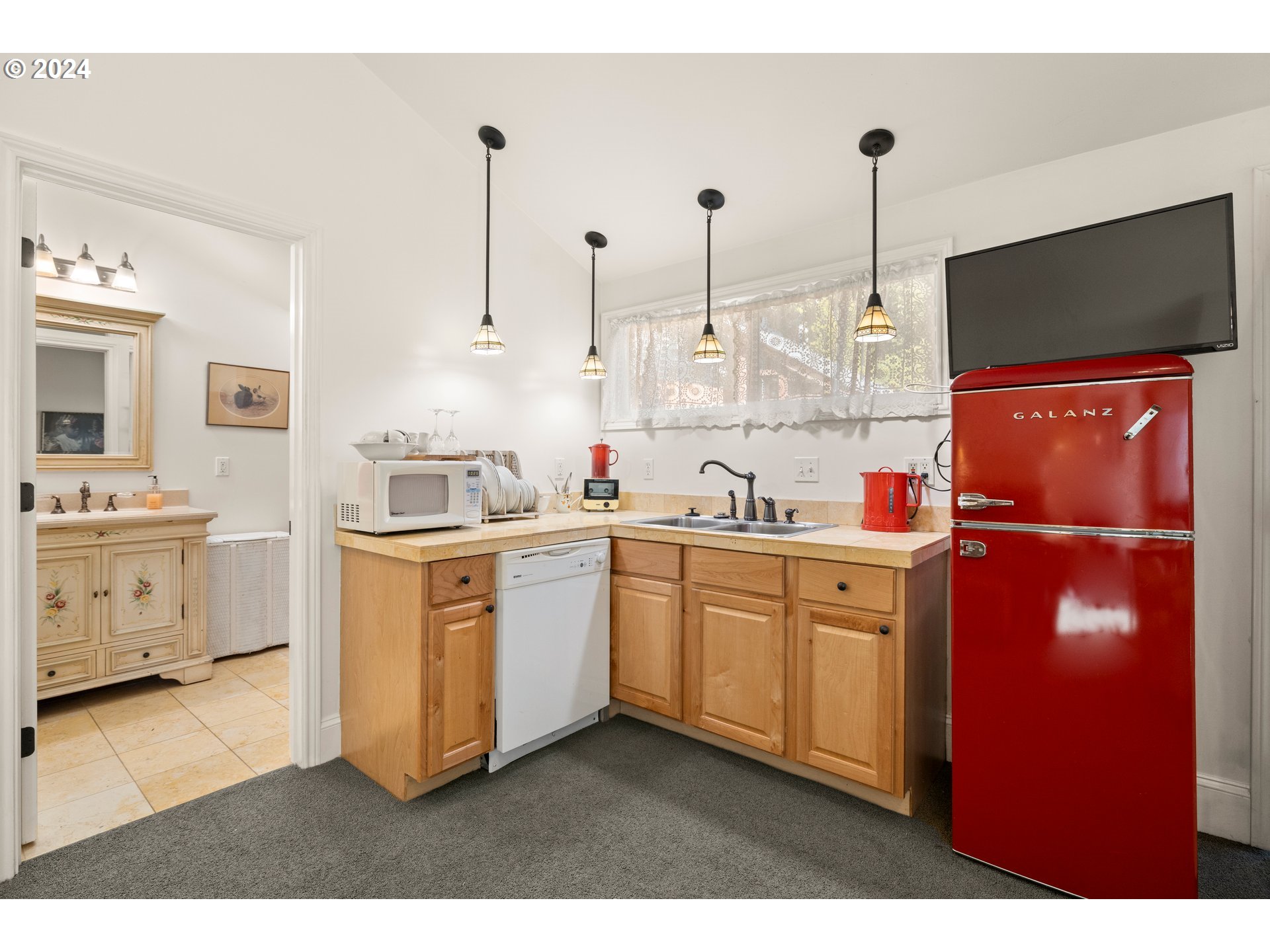 1927 Northeast 16th Avenue Portland, OR 97212 - Photo 36 of 43 a kitchen with white cabinets and white appliances