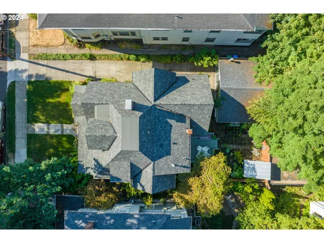 an aerial view of house with yard swimming pool and outdoor seating
