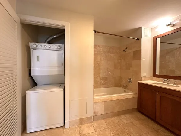 a bathroom with a bathtub and a sink