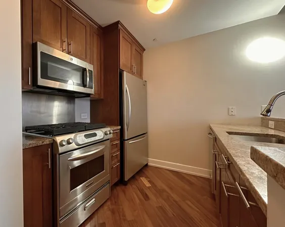 a kitchen with a stove and a microwave