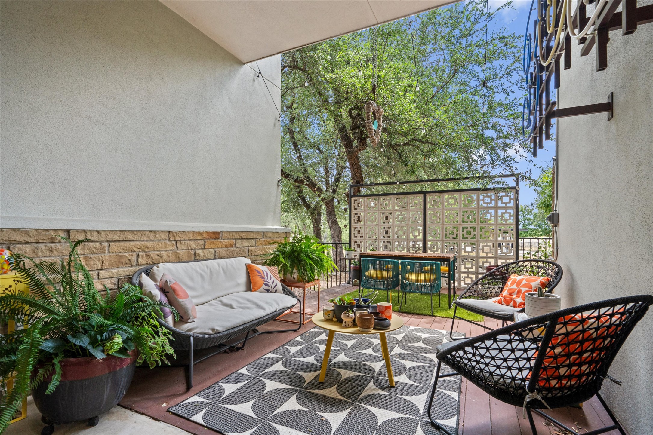 408 Starlight Village Loop Leander, TX 78641 - Photo 37 of 40 A spacious outdoor terrace offers privacy and ample room for relaxation and entertaining amidst lush greenery.