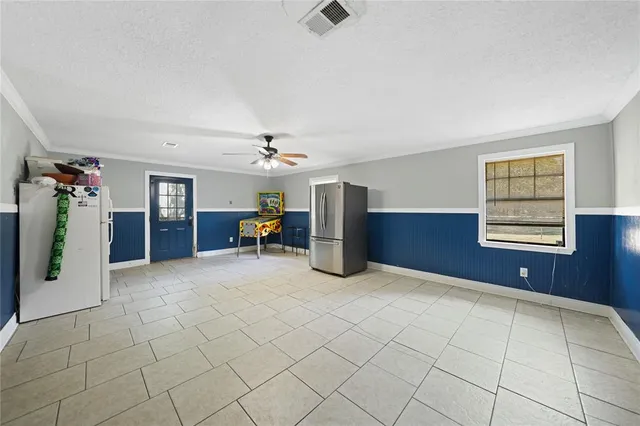 a view of a livingroom with furniture and a window