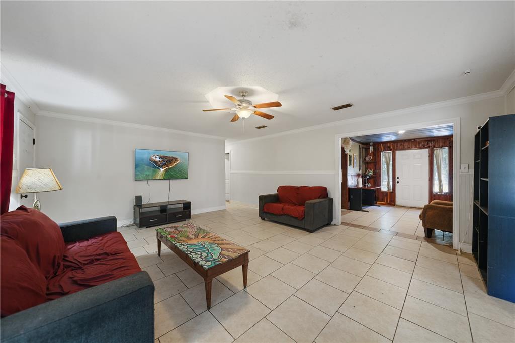 288 County Road 1858 Yantis, TX 75497 - Photo 7 of 18 a living room with furniture and a chandelier