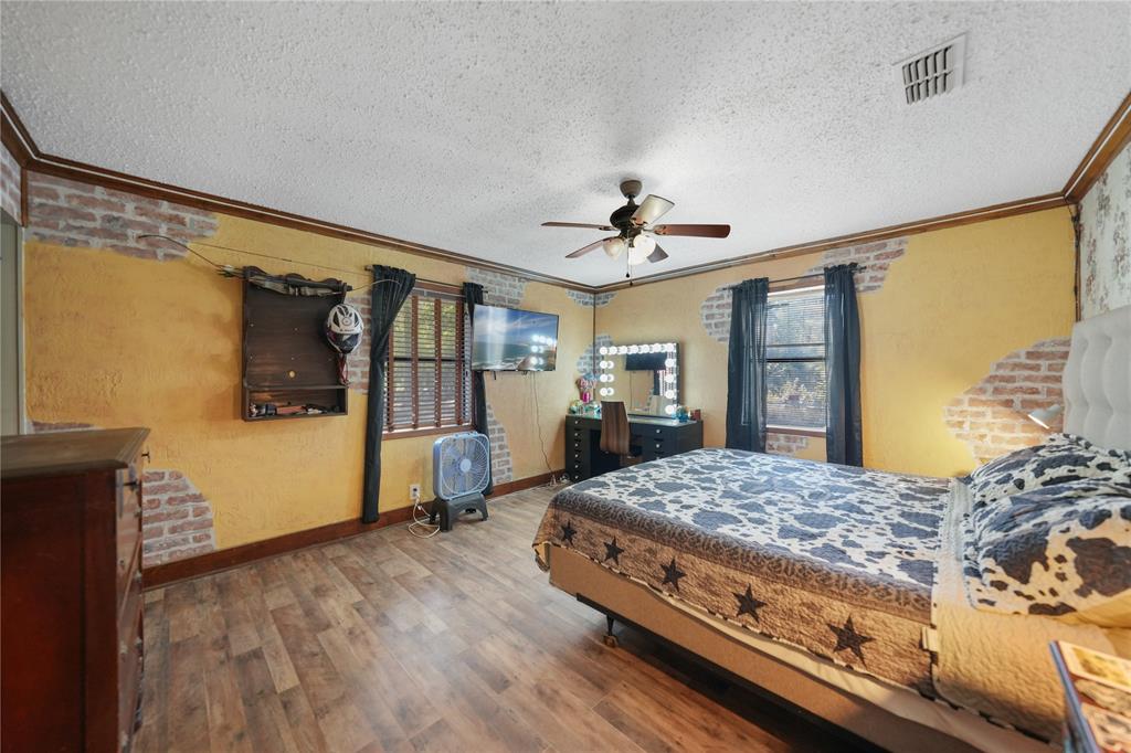 288 County Road 1858 Yantis, TX 75497 - Photo 9 of 18 a bedroom with a bed and wooden floor