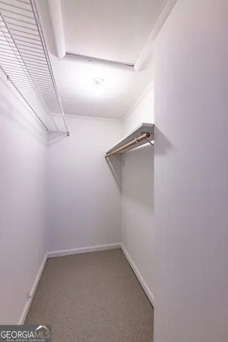 a bathroom with a toilet a sink a shower and a mirror