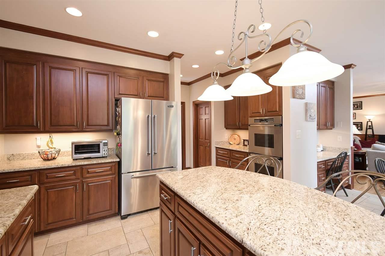 5220 Lenoraway Drive Raleigh, NC 27613 - Photo 11 of 30 Recessed lighting, stainless steel appliances, double wall ovens, and gas cooktop. Walk in pantry around the corner with lots of shelving.