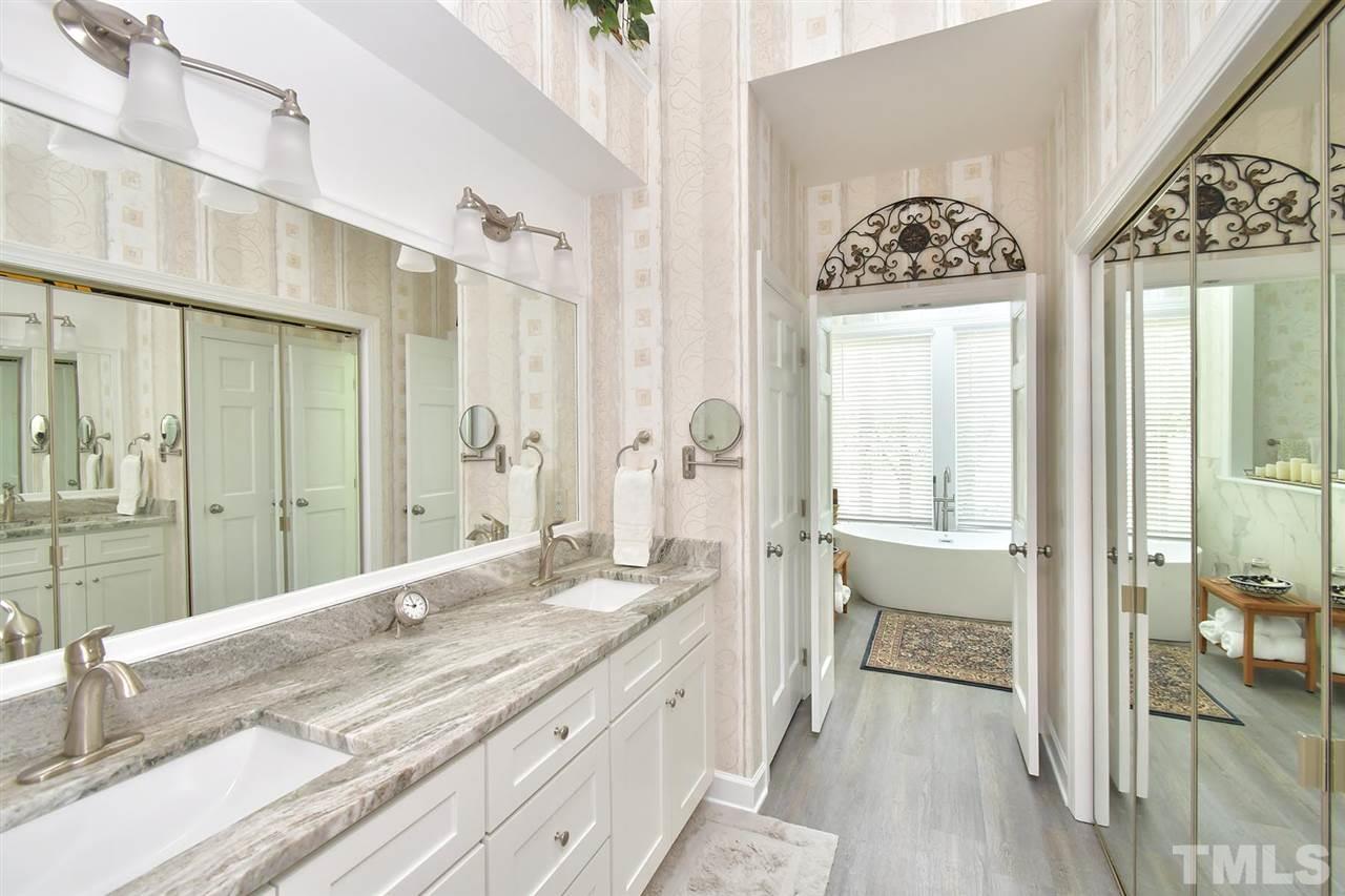 5220 Lenoraway Drive Raleigh, NC 27613 - Photo 14 of 30 Gorgeously renovated 2020 Master Bathroom with dual vanity, walk in closet, and large soaking tub.