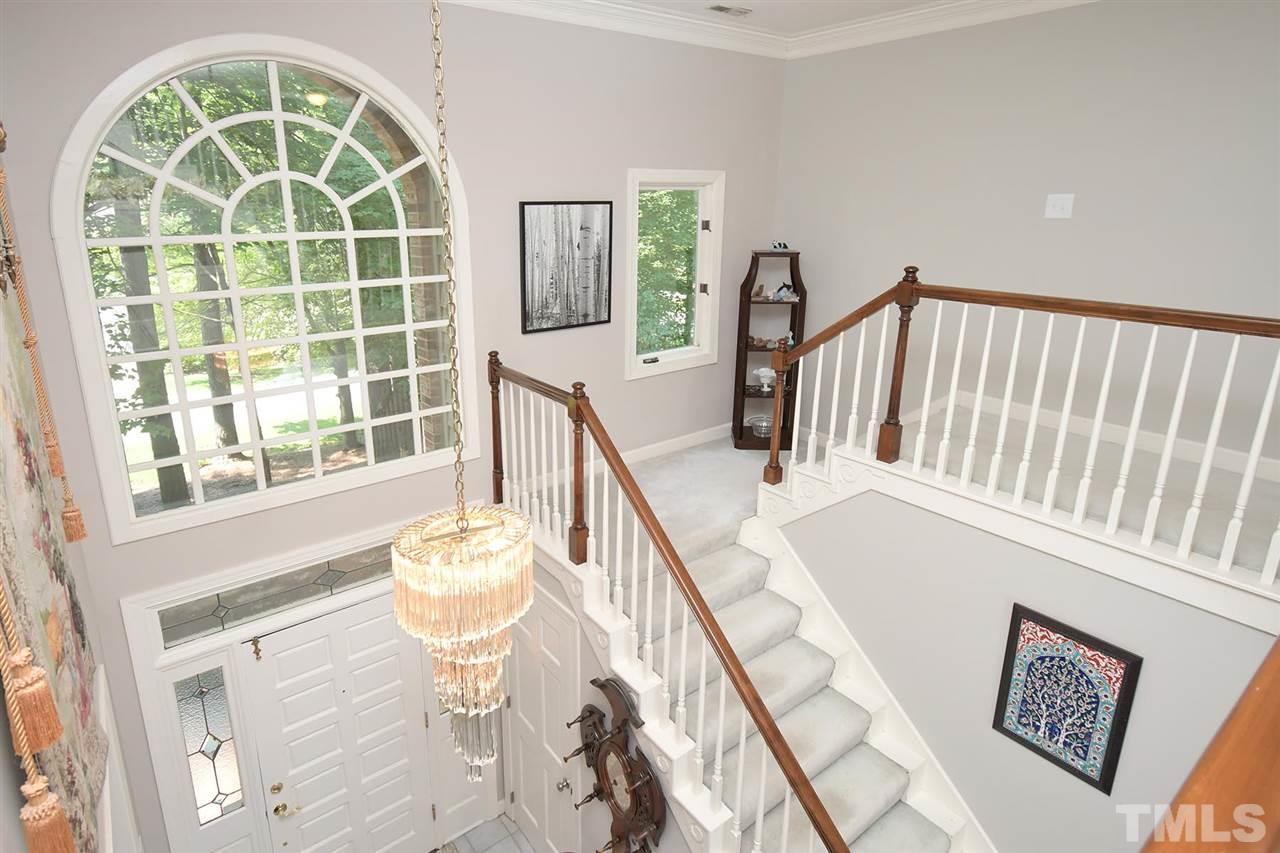 5220 Lenoraway Drive Raleigh, NC 27613 - Photo 17 of 30 Foyer heading upstairs with amazing palladium window.