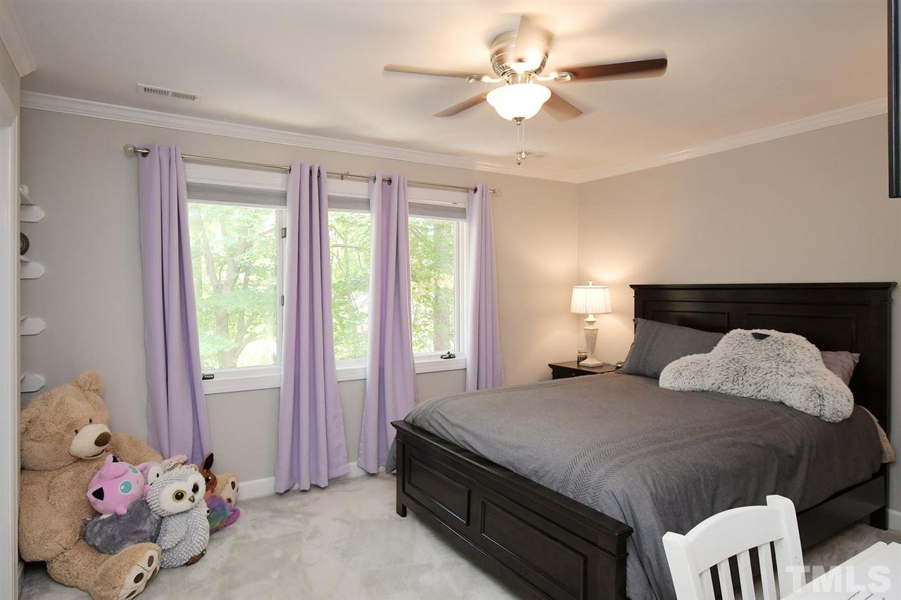 5220 Lenoraway Drive Raleigh, NC 27613 - Photo 21 of 30 Bedroom 4 on second floor with triple windows, ceiling fan, and door to access hallway full bath.