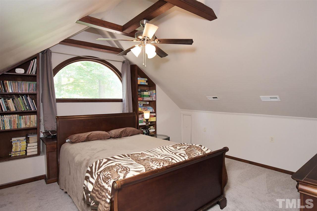 5220 Lenoraway Drive Raleigh, NC 27613 - Photo 25 of 30 Endless possibilities with third floor flex room. Built in bookshelving all around window.