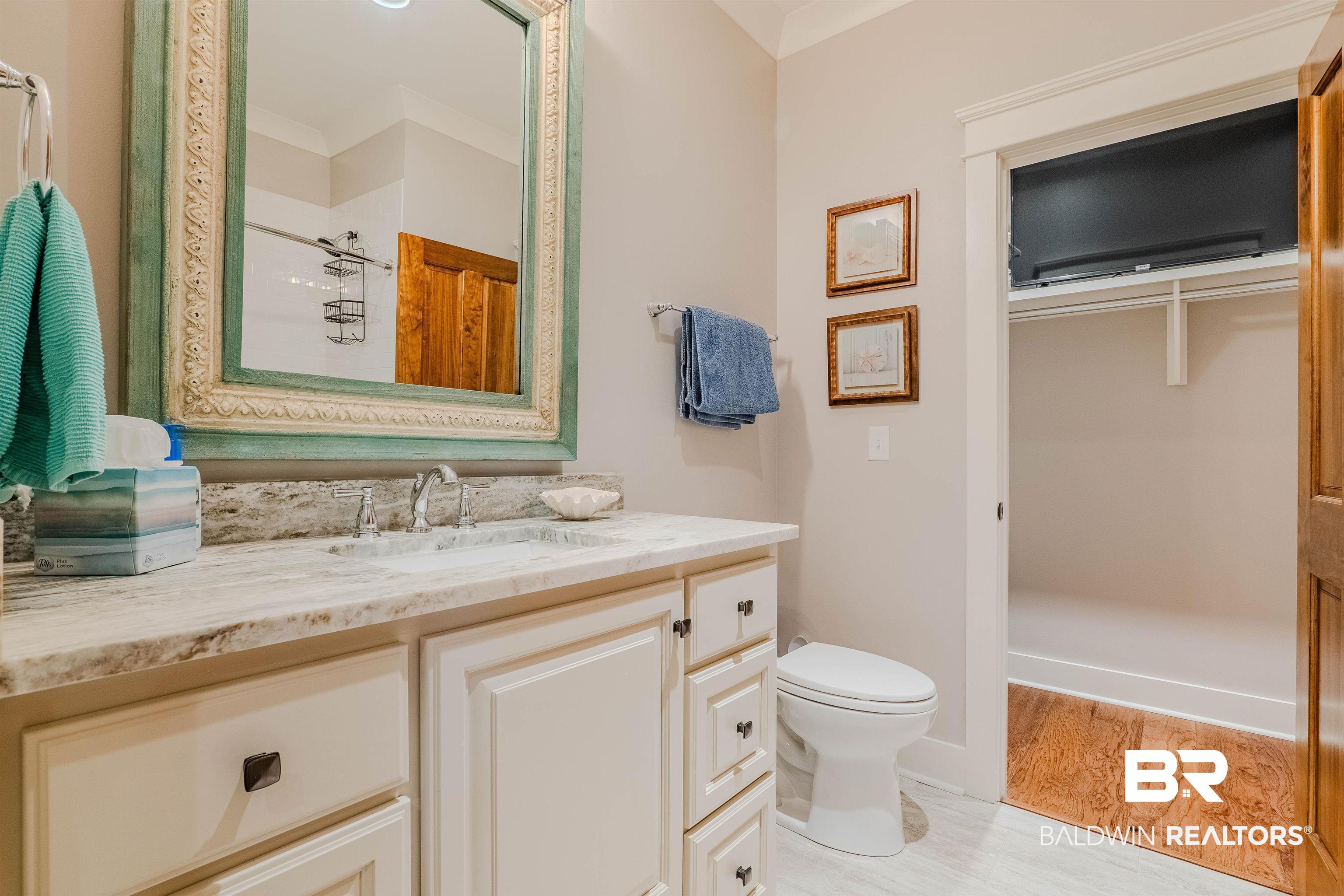 708 Manning Place Fairhope, AL 36532 - Photo 34 of 58 Bathroom with vanity, hardwood / wood-style floors, toilet, and walk in shower