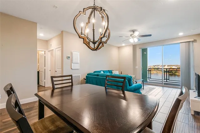 a kitchen with a table and chairs in it