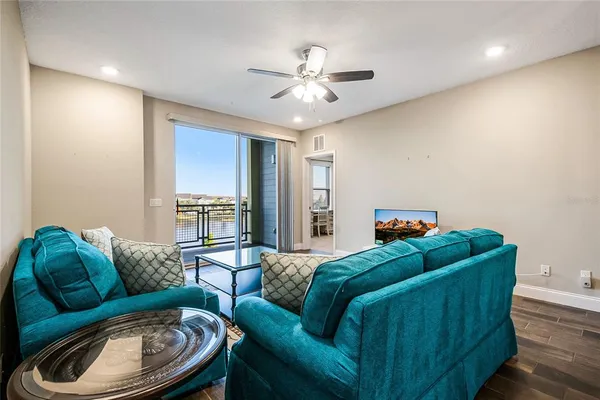 a view of a room with a table and chairs