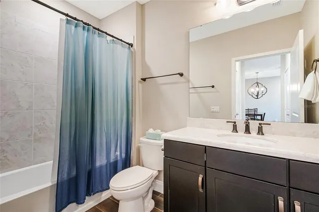 a kitchen with a stove and a refrigerator