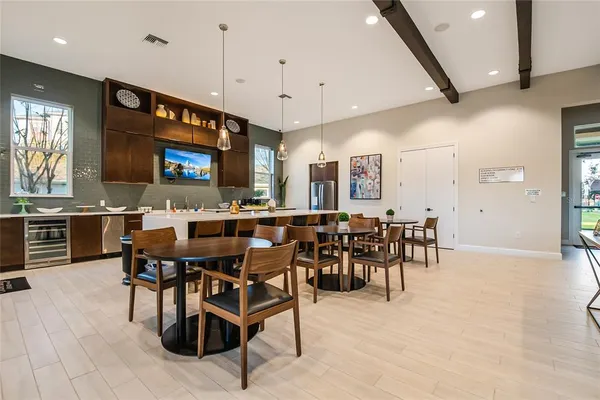a view of a dining room with furniture and a chandelier