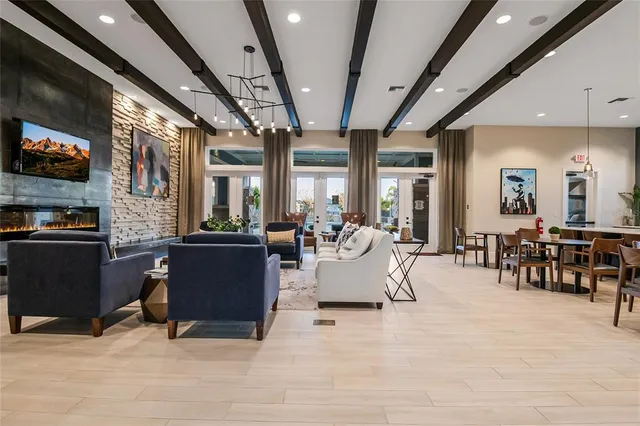 an aerial view of residential houses with outdoor space and swimming pool