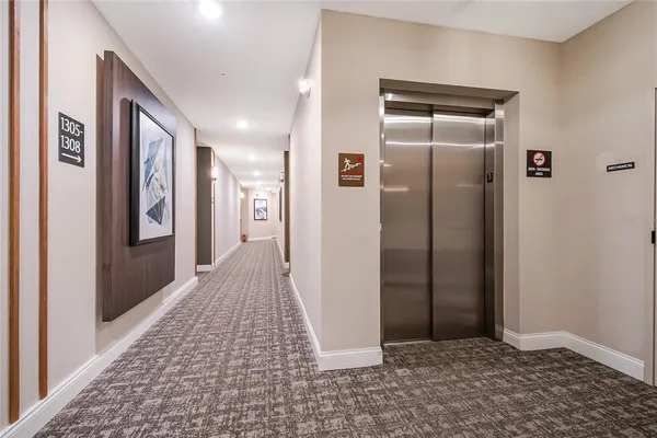 a view of a hallway with a livingroom