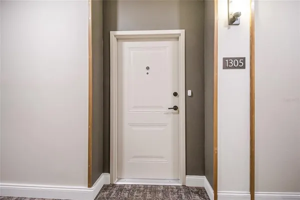 a view of a refrigerator in kitchen and wooden floor