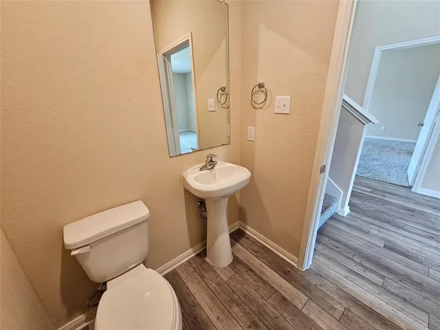 a bathroom with a toilet and a sink