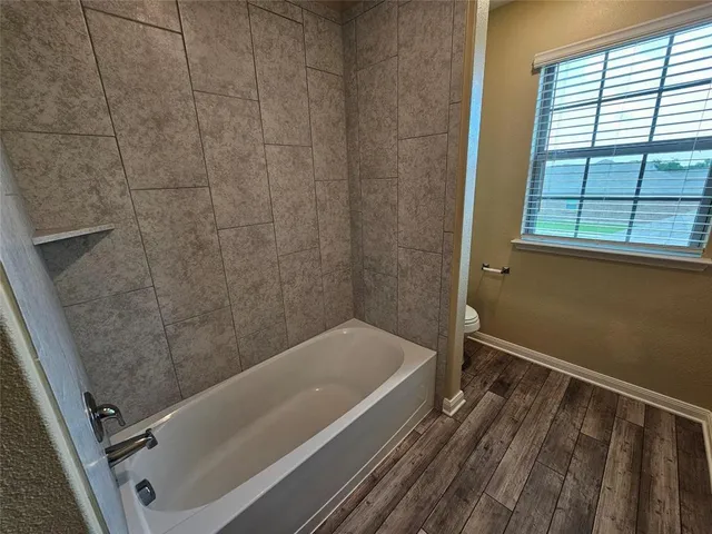 a bathroom with a sink and a bathtub