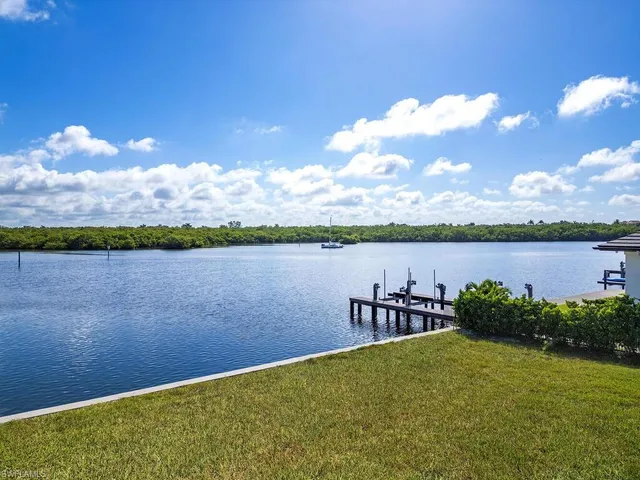 a view of a lake with a yard