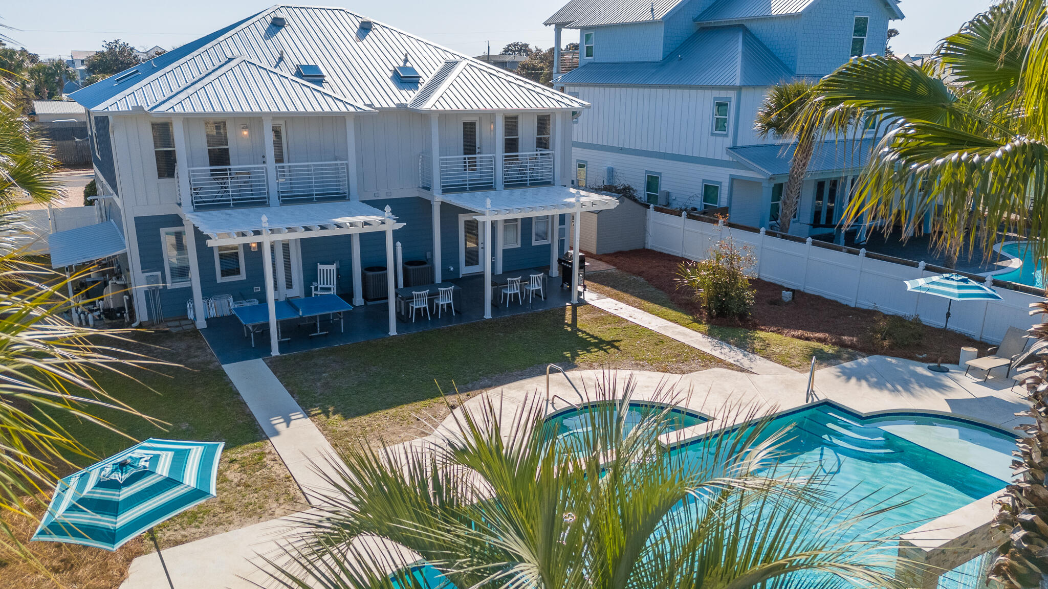 4579 Luke Avenue Destin, FL 32541 - Photo 6 of 56 a view of a house with backyard porch and sitting area