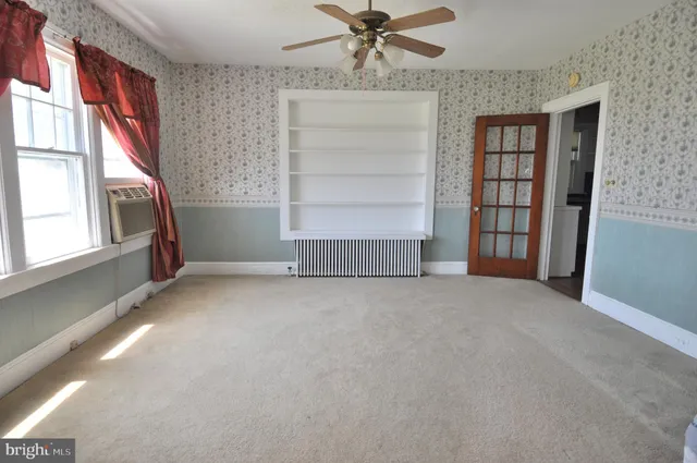 a view of an empty room with a window