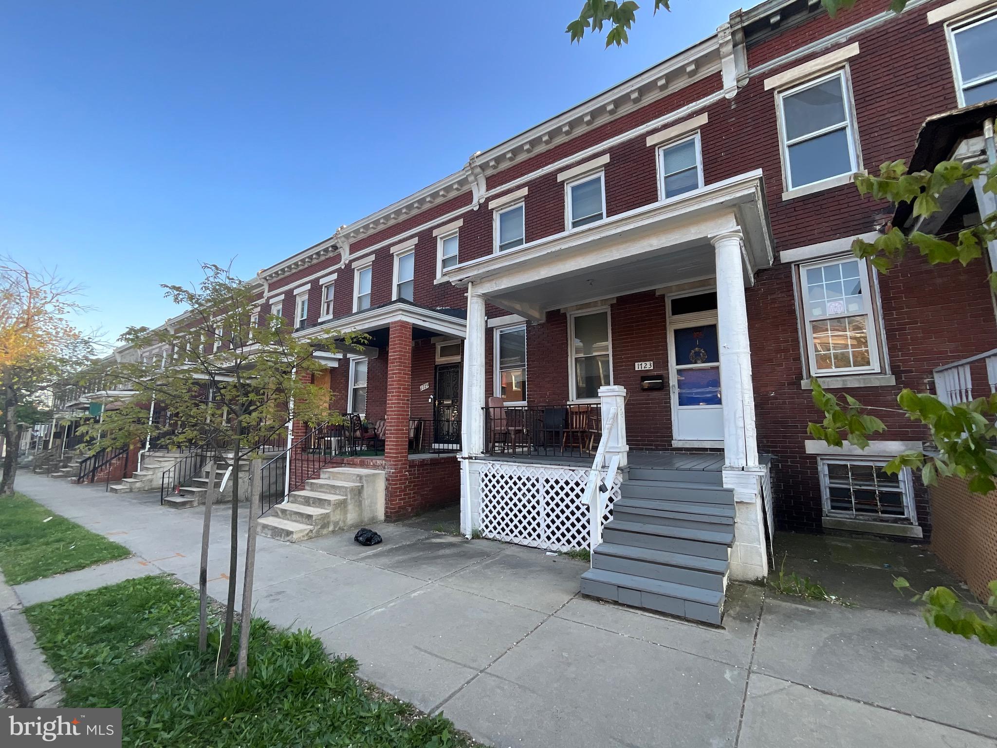 1723 East 25th Street Baltimore, MD 21213 - Photo 2 of 16 a front view of a house with a porch
