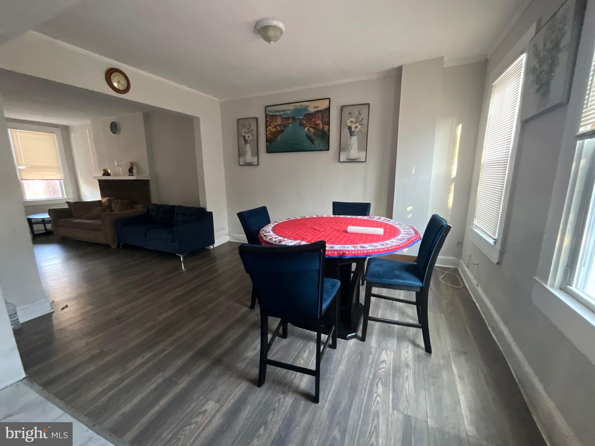 1723 East 25th Street Baltimore, MD 21213 - Photo 5 of 16 a view of a dining room with furniture and wooden floor