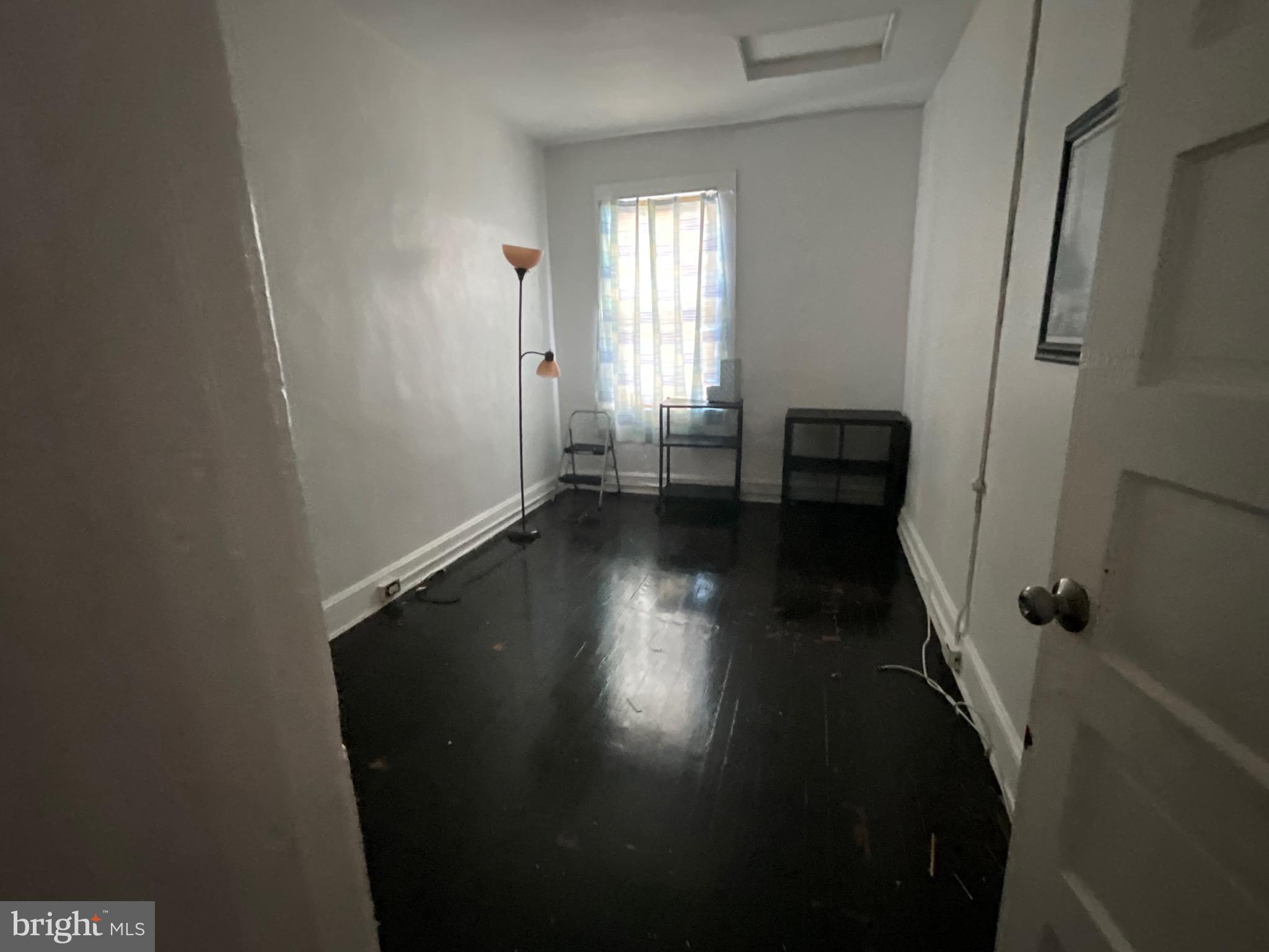 1723 East 25th Street Baltimore, MD 21213 - Photo 10 of 16 a view of an empty room with a window