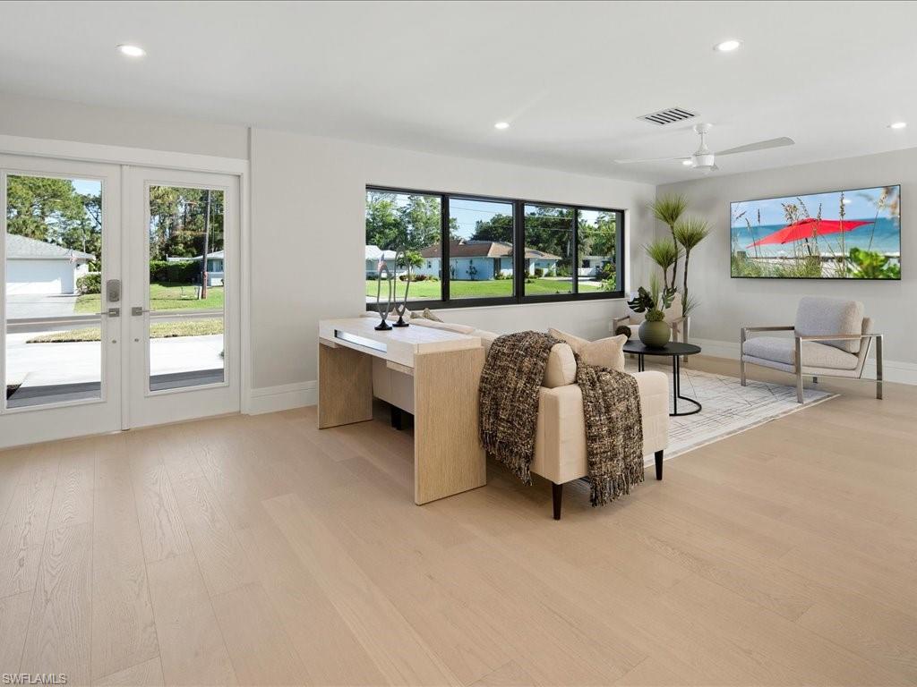 518 Cypress Way East Naples, FL 34110 - Photo 8 of 50 Living area with light wood-type flooring, visible vents, plenty of natural light, and recessed lighting