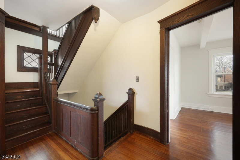 7 Olyphant Drive, Unit 2 Morristown, NJ 07960 - Photo 13 of 22 a view of an entryway with wooden floor and stairs