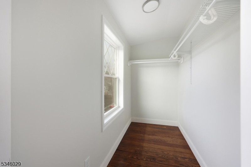 7 Olyphant Drive, Unit 2 Morristown, NJ 07960 - Photo 17 of 22 a view of an empty room with wooden floor and a window