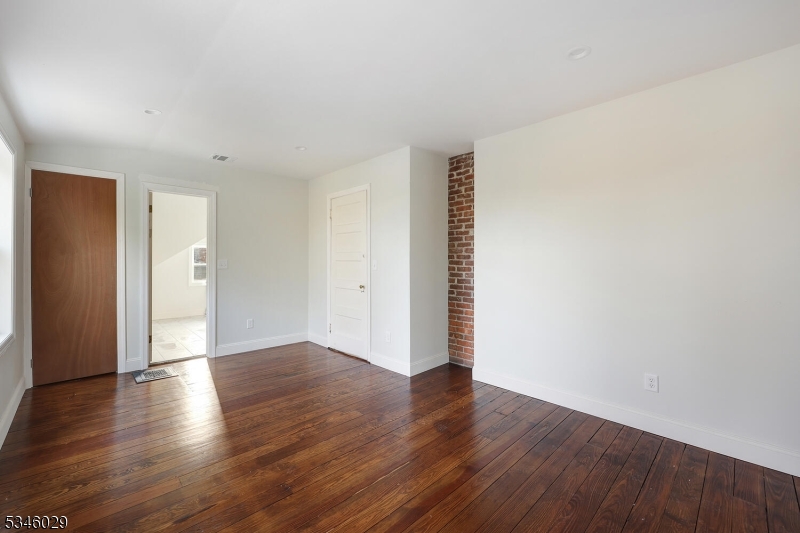 7 Olyphant Drive, Unit 2 Morristown, NJ 07960 - Photo 19 of 22 a view of an empty room with wooden floor and closet