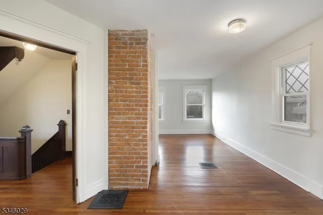 a view of livingroom with hardwood floor and hallway
