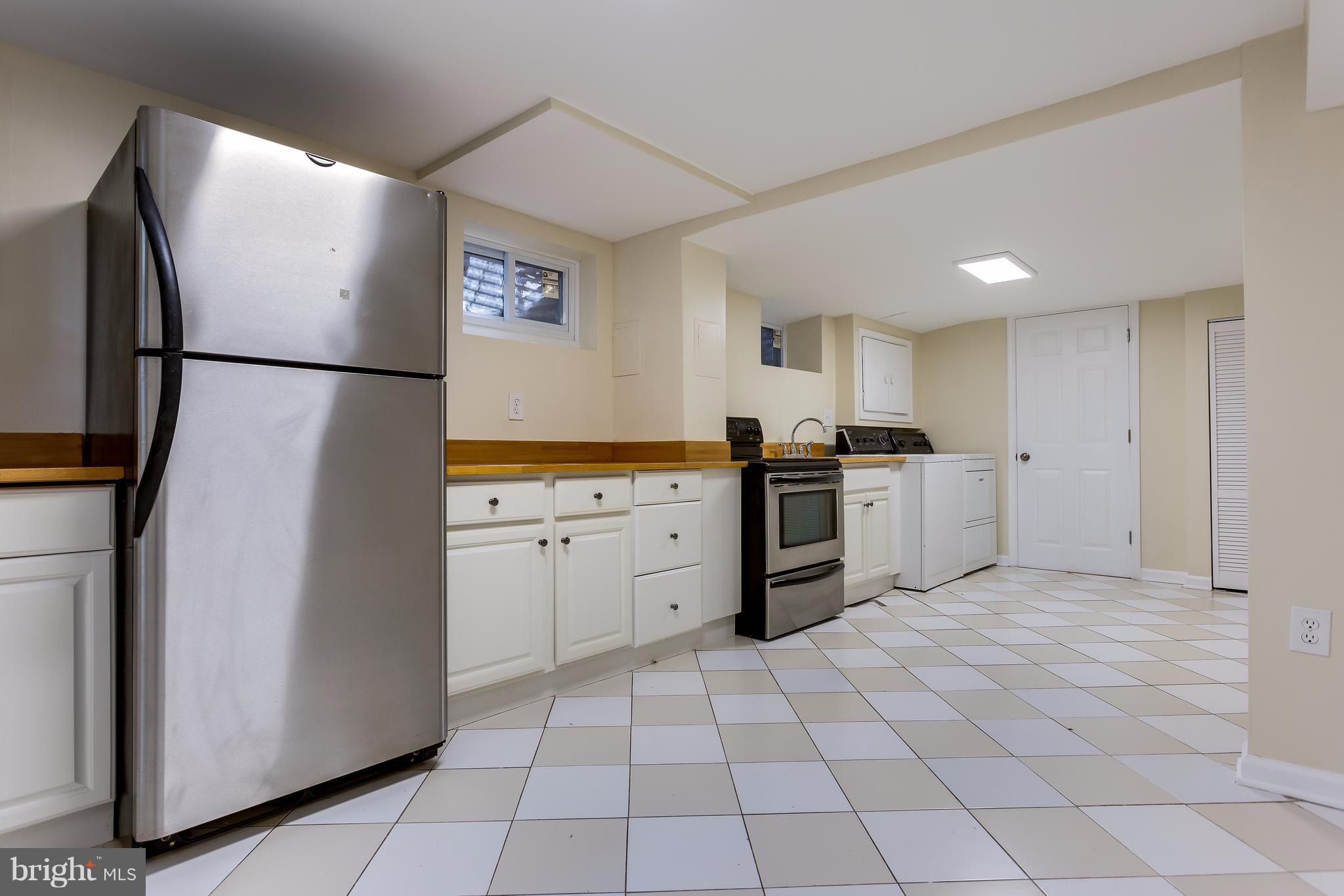 8919 Burke Lake Road Springfield, VA 22151 - Photo 21 of 30 In-law suite's kitchen w/range and fridge.
