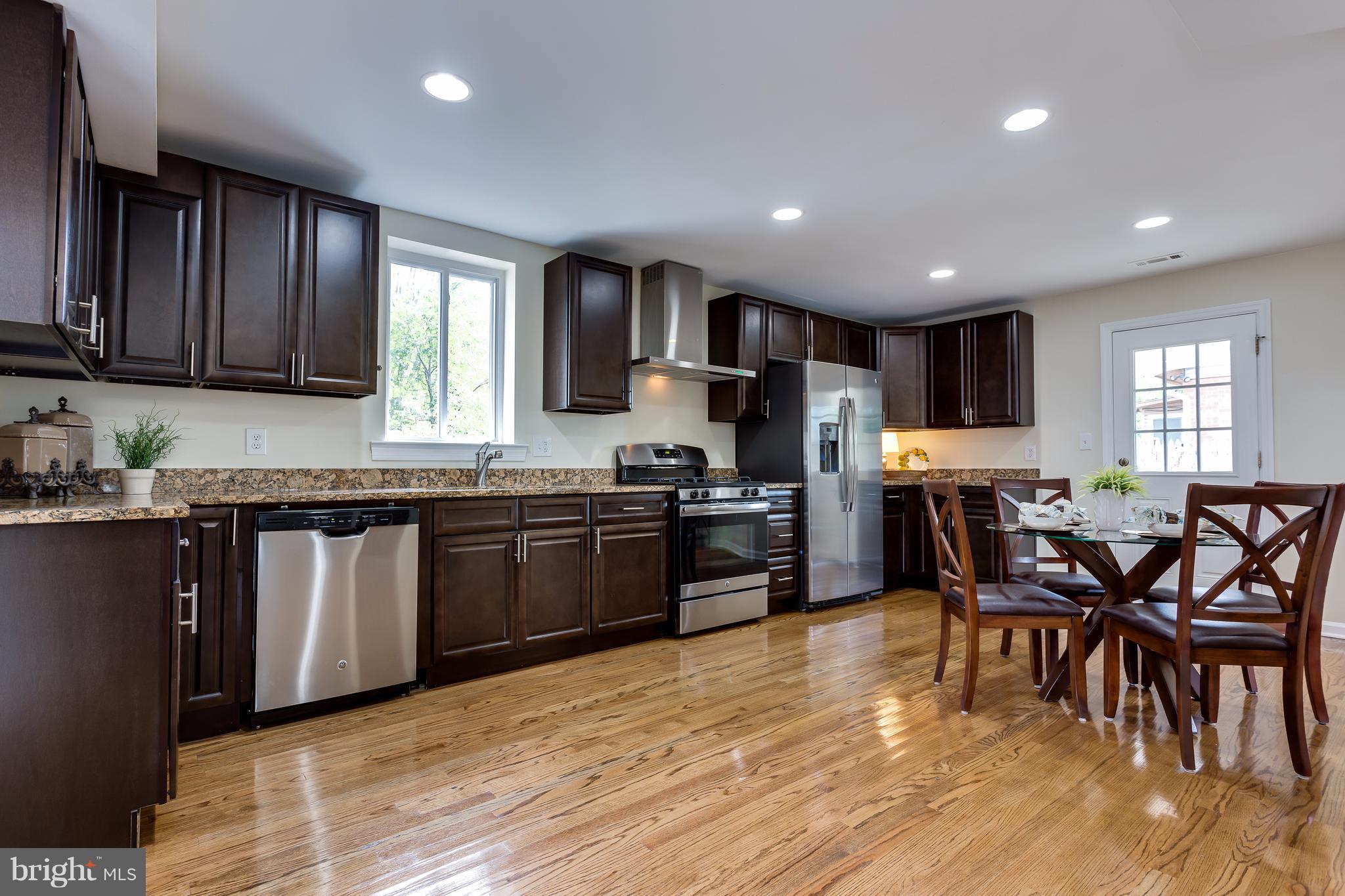 8919 Burke Lake Road Springfield, VA 22151 - Photo 5 of 30 Plenty of cabinets, granite counters in EIK.
