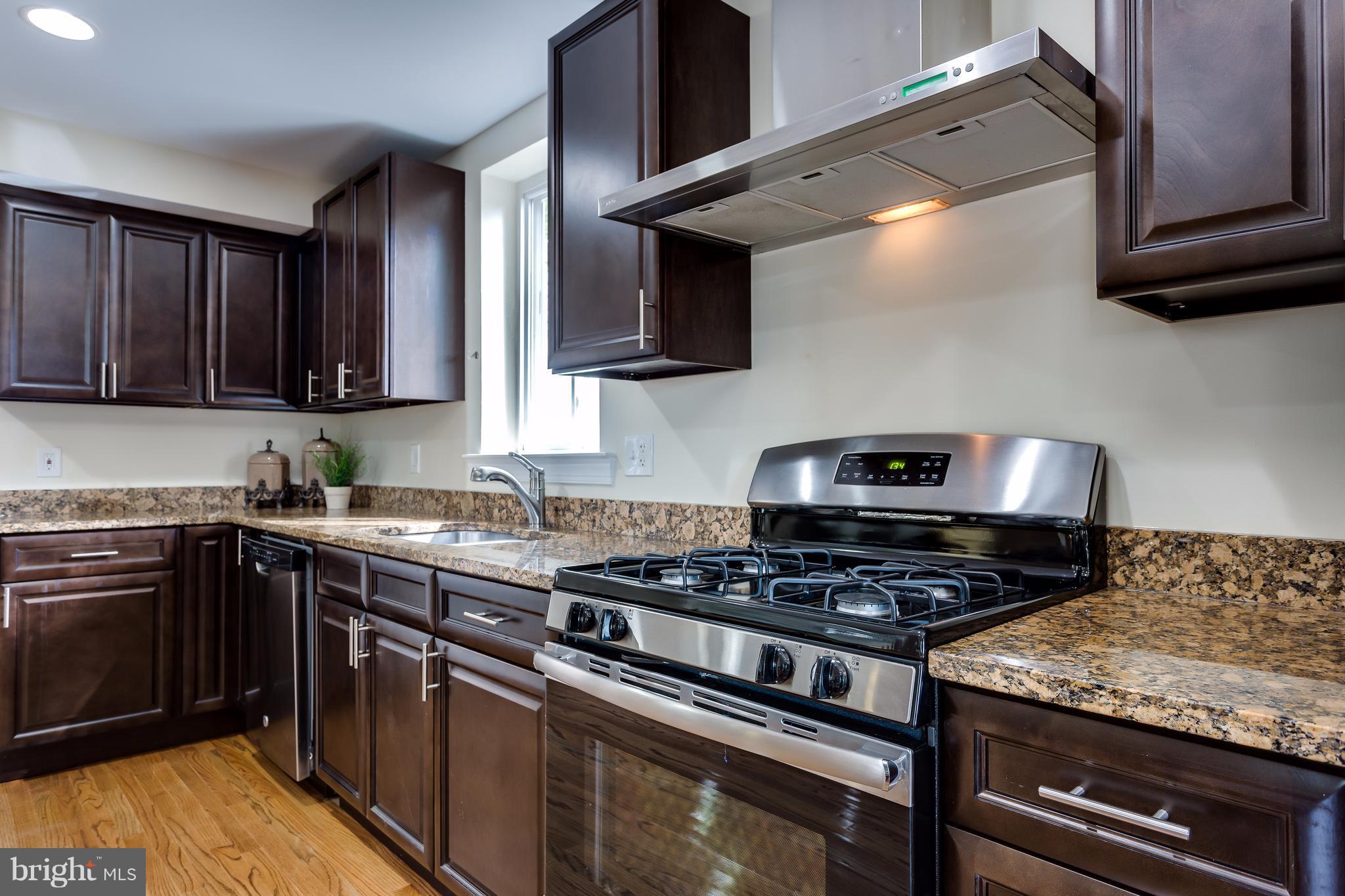 8919 Burke Lake Road Springfield, VA 22151 - Photo 7 of 30 SS appliances, including gas range and hood.