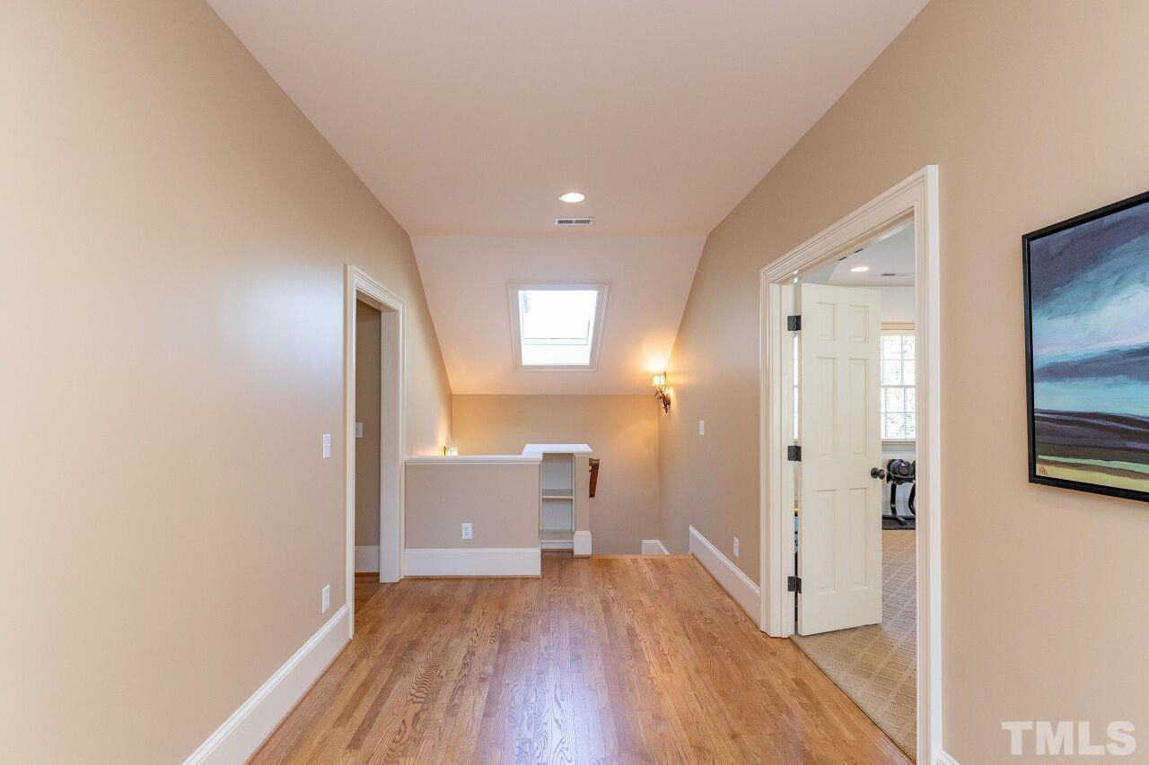 1914 Lewis Circle Raleigh, NC 27608 - Photo 23 of 55 a view of a room with wooden floor and a bathroom