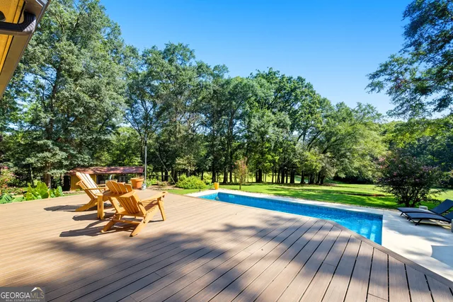 a view of a park with slide and bench