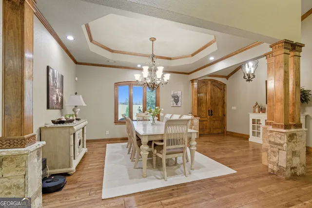 a view of a dining room with furniture and wooden floor
